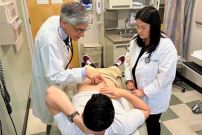 two doctors examine patient